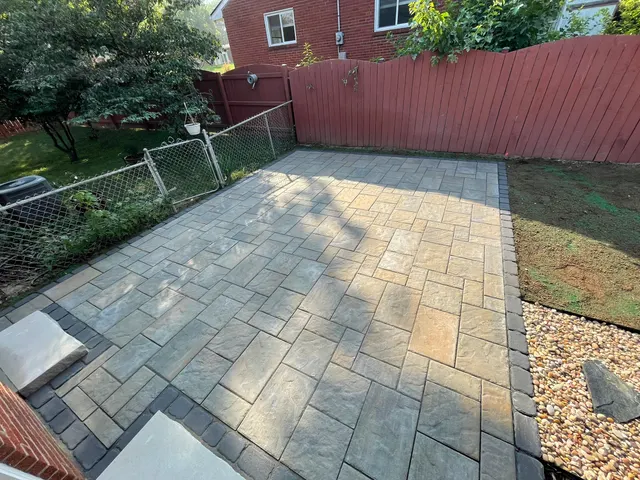 Rectangular paver patio with a dark contrasting edge