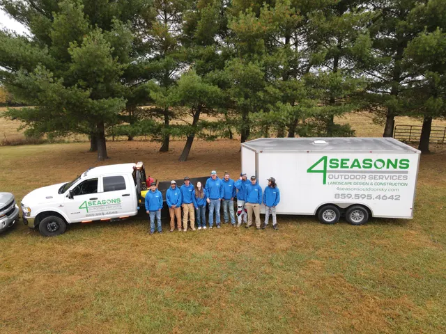 4 Seasons crew beside the company truck and trailer