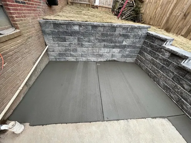 Gray block retaining walls around a concrete landing